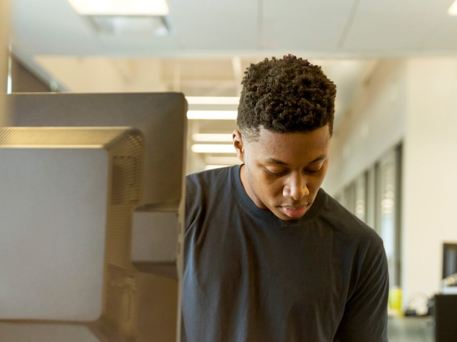A student concentrating at a computer in a CBT centre